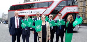 Baroness Kramer, Claire Haigh and Bus company MD’s in front of a silver Routemaster bus